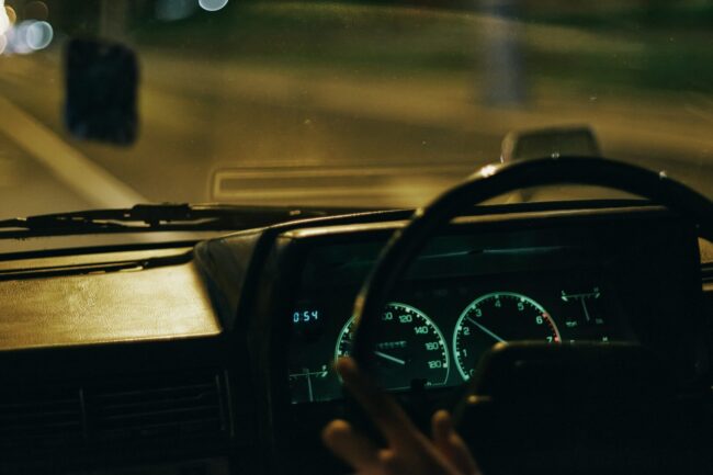 A person driving a car at night
